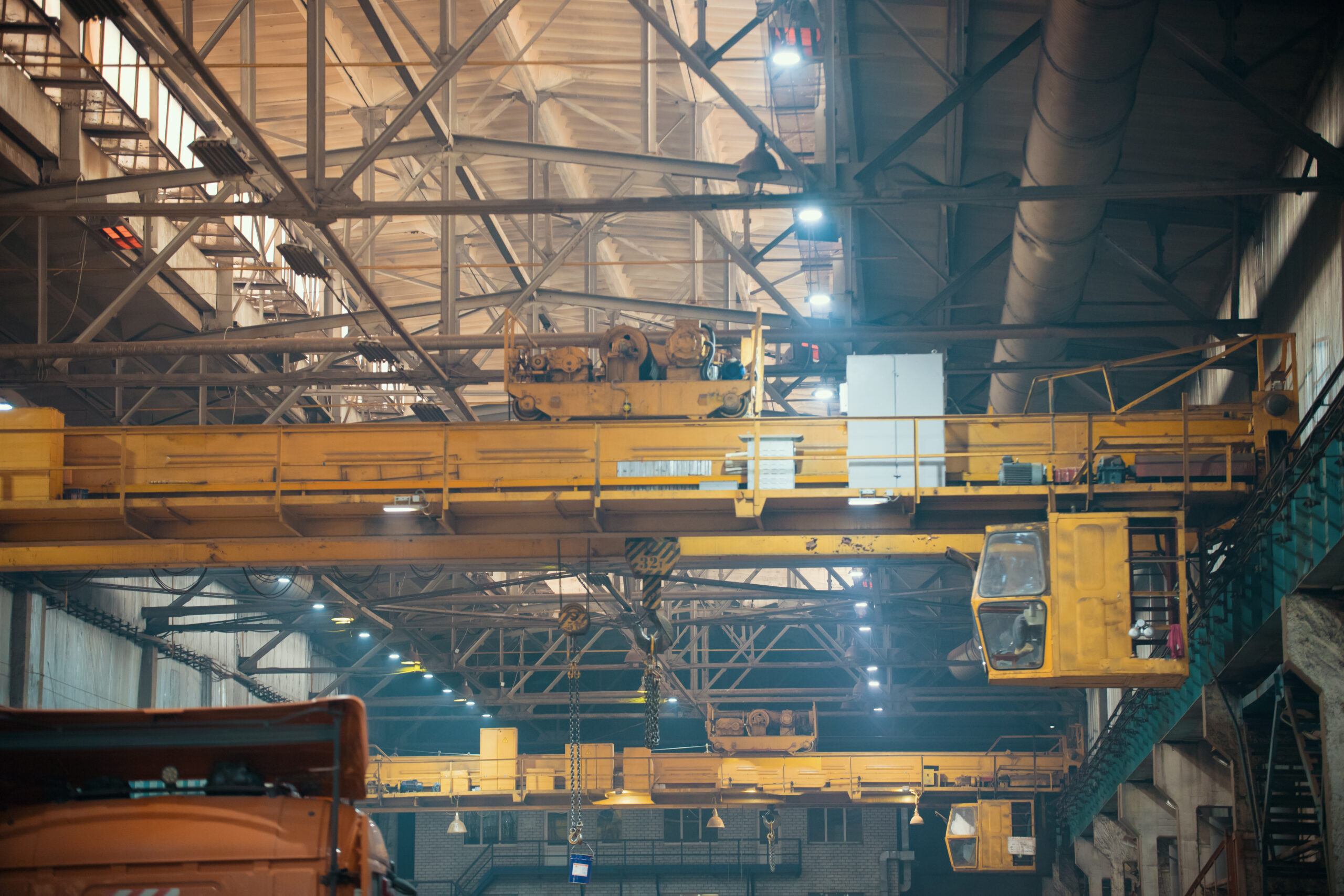 Industrial concept. People working on a manufartouring plant. A bridge for comfortable movement of employees